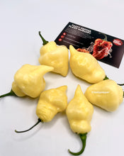 Load image into Gallery viewer, White UFO peppers with a Tasty Pepper Plant Nursery card in the background
