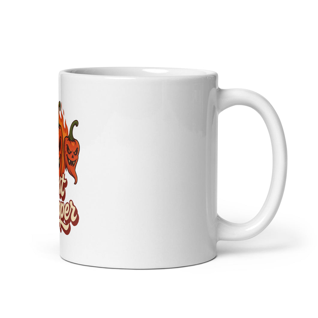 White mug with a red chili pepper graphic and text on a white background